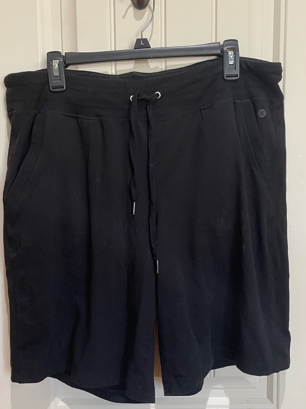Woman’s Black Athletic Shorts with Side Pockets and one back pocket.